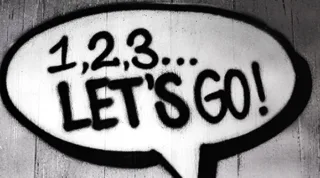 1, 2, 3 "Lets Go als Graffiti in einer Sprechblase auf einer Wand
